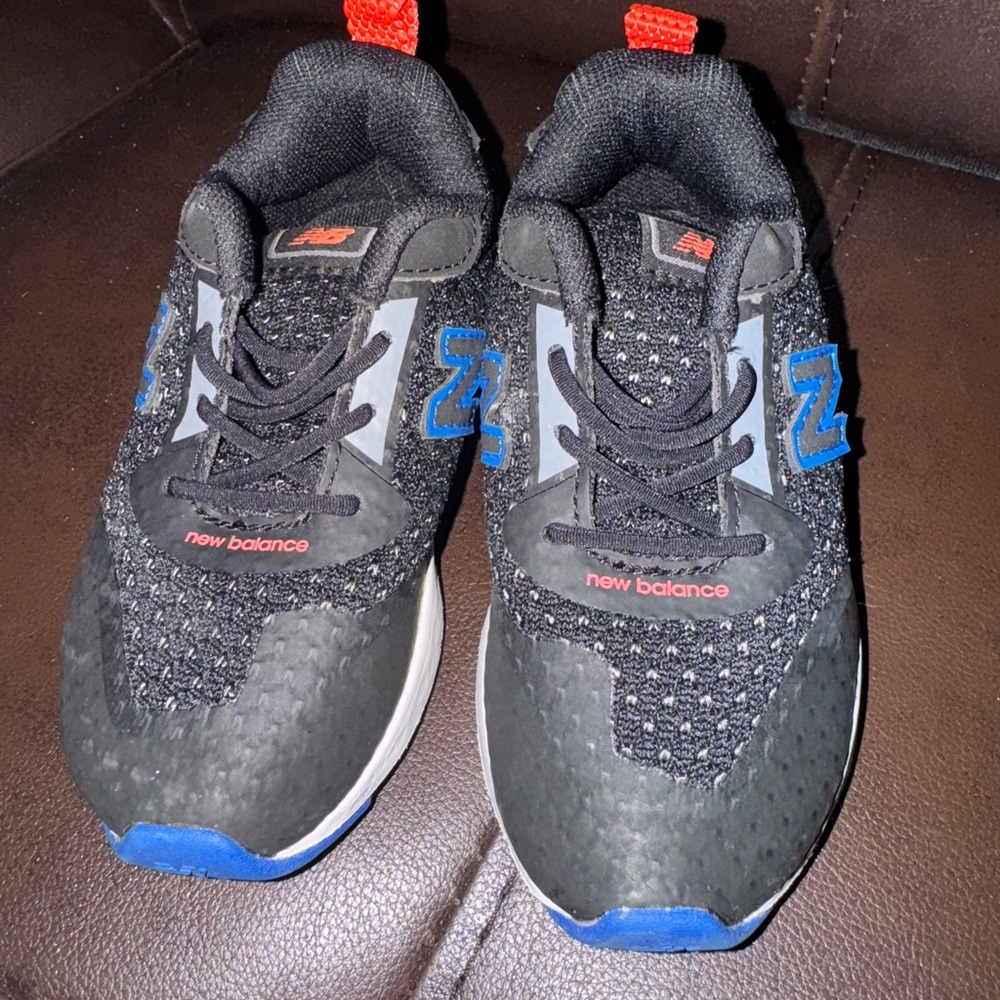 New Balance Black Sneakers with Blue and Red Accents